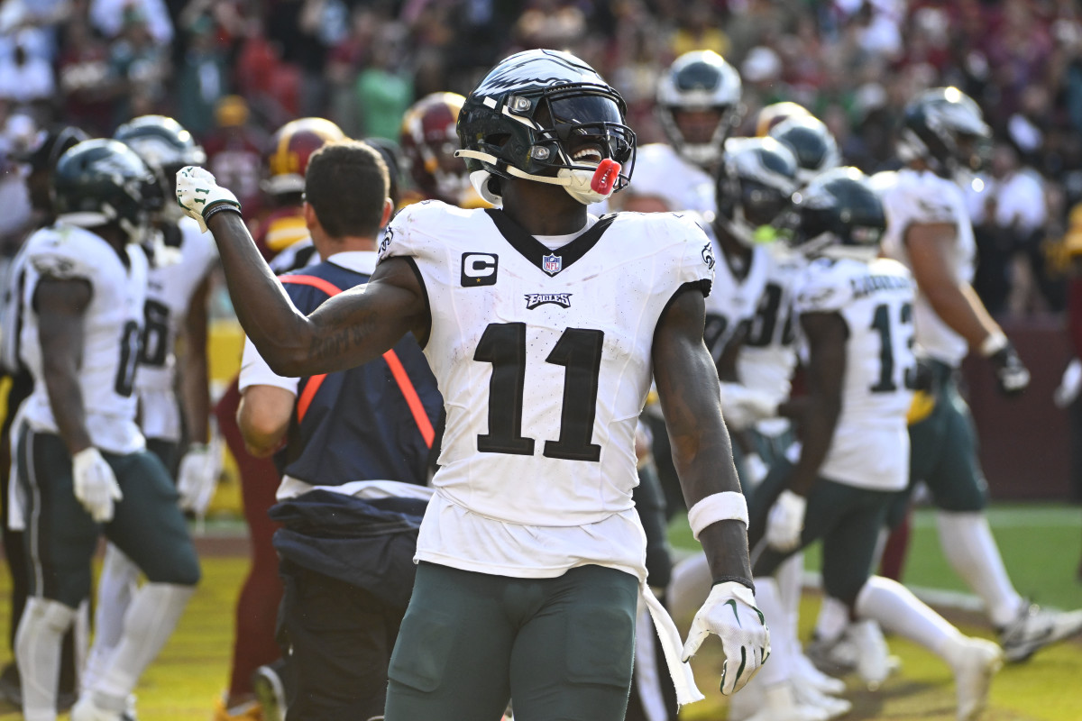 Philadelphia Eagles wide receiver A.J. Brown (11) celebrates after a touchdown against the Washington Commanders during the second half at FedExField.